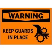 Safety sign with warning text 'WARNING KEEP GUARDS IN PLACE' on an orange background.