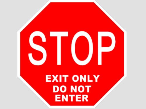 Red stop sign with white text on a gray background