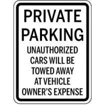 Private parking sign indicating unauthorized cars will be towed away at vehicle owner's expense.