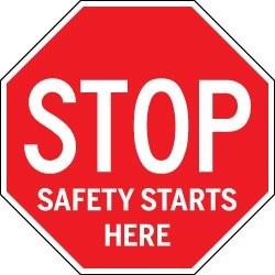 Red stop sign with 'Safety Starts Here' text on a white background