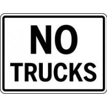No Trucks sign with black text on a white background
