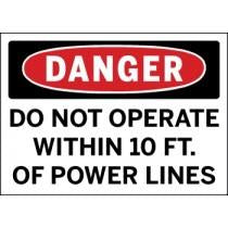 Safety sign warning about operating equipment near power lines