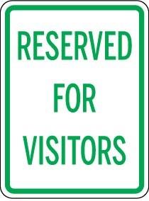 Sign with 'RESERVED FOR VISITORS' text on a white background