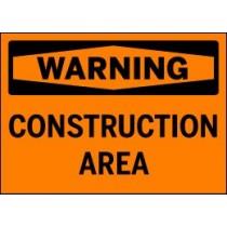 Warning sign indicating a construction area on an orange background