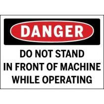 Safety sign warning 'Do not stand in front of machine while operating' with a red circle and black border.