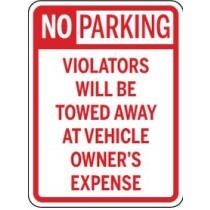 No parking sign with text about towing and vehicle owner's expense.