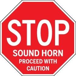 Red stop sign with additional text 'Sound Horn, Proceed with Caution' on a white background