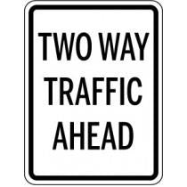 Two way traffic ahead sign with black text on a white background