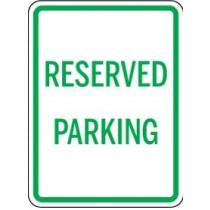 Reserved parking sign with green text on a white background