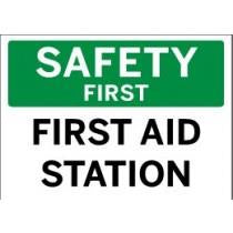 Safety first sign with 'First Aid Station' text on a green and white background