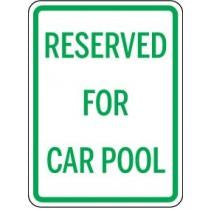 Sign indicating 'Reserved for Car Pool' with green text on a white background