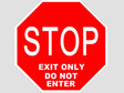 Red stop sign with white text on a gray background