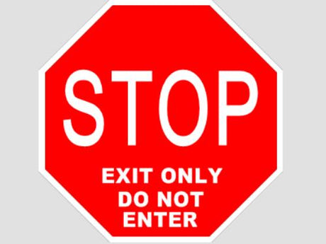 Red stop sign with white text on a gray background