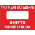 Red sign with white text stating 'This plant has worked shifts without an injury' on a red background