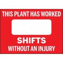 Red sign with white text stating 'This plant has worked shifts without an injury' on a red background