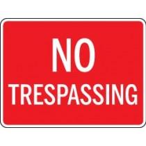 No Trespassing sign on a red background