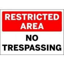 Sign with 'RESTRICTED AREA NO TRESPASSING' text on a white background