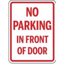 No parking in front of door sign with red text on a white background