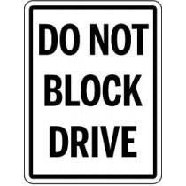 Traffic sign with 'Do Not Block Drive' text on a white background