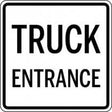 Sign with 'TRUCK ENTRANCE' text on a white background