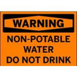 Warning sign indicating non-potable water do not drink on an orange background