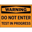 Warning sign with text 'DO NOT ENTER TEST IN PROGRESS' on an orange background