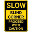 Warning sign indicating a blind corner with caution.