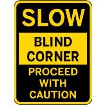Warning sign indicating a blind corner with caution.