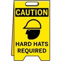 Caution sign with hard hat icon and text 'Hard Hats Required' on a yellow background