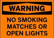 Warning sign with text 'No Smoking Matches or Open Lights' on an orange background