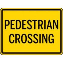 Yellow pedestrian crossing sign with black text