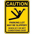 Caution sign warning about slippery parking lot conditions.