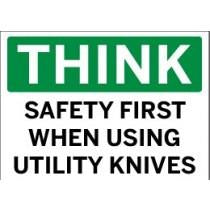 Safety sign with text 'THINK SAFETY FIRST WHEN USING UTILITY KNIVES' on a green background