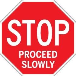 Red stop sign with 'STOP PROCEED SLOWLY' text