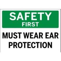 Safety sign with 'Safety First Must Wear Ear Protection' text on a green and white background