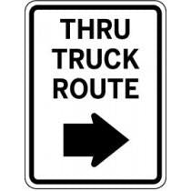 Traffic sign indicating 'Thru Truck Route' with an arrow pointing right.