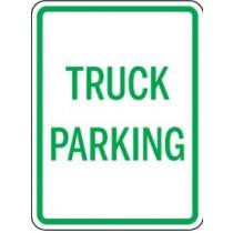 Sign indicating truck parking area with green text on a white background