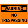 No Trespassing warning sign on an orange background