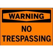 No Trespassing warning sign on an orange background