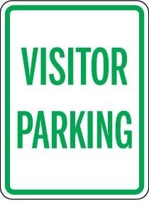 Visitor parking sign with green text on a white background