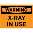 Warning sign with 'X-Ray In Use' text on an orange background