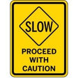 Yellow and black caution sign with text 'SLOW PROCEED WITH CAUTION'.