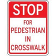 Traffic sign warning drivers to stop for pedestrians in crosswalks.