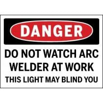 Safety sign warning about the dangers of watching an arc welder at work.