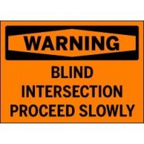 Warning sign for blind intersection with text 'WARNING BLIND INTERSECTION PROCEED SLOWLY'.