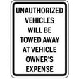 Sign warning about unauthorized vehicles being towed at owner's expense