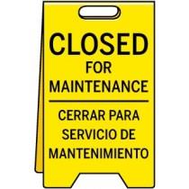 Yellow sign with 'Closed for Maintenance' text in English and Spanish