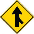 Yellow traffic sign with black arrow on a white background