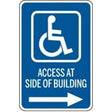 Handicap access sign with wheelchair icon and text 'Access at Side of Building' on a white background