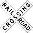 Railroad crossing sign with 'RAILROAD CROSSING' text.